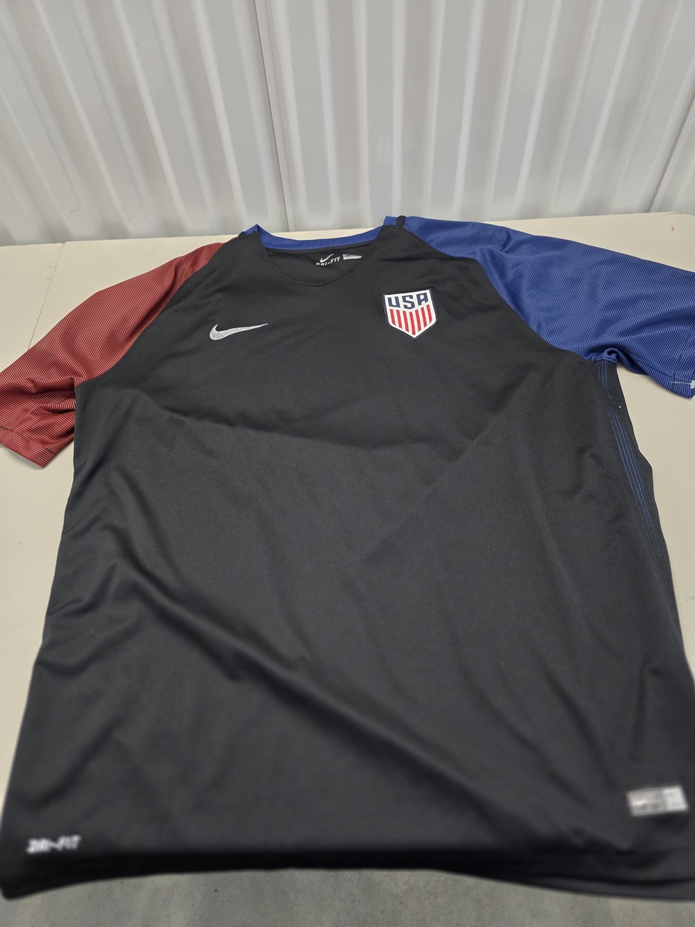 Nike Men's Black USA Soccer Jersey with Red Left Sleeve and Blue Right Sleeve